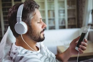 man listening to headphones