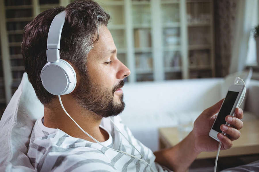 man listening to headphones