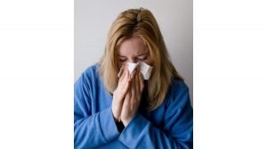 woman sneezing